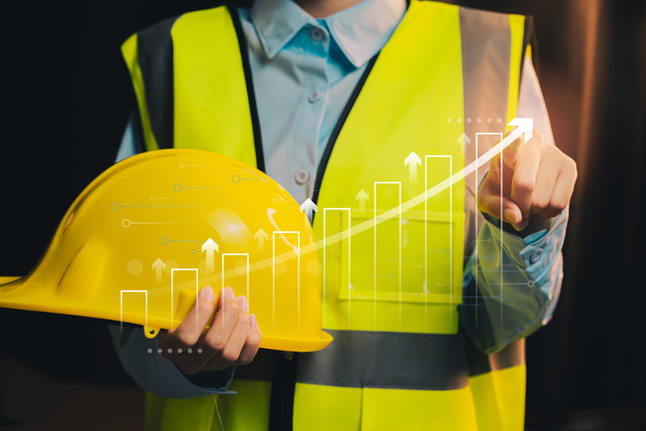 Growth concept. Construction Worker with Safety Helmet and Progress Graph Illustrating Growth in Construction Industry Performance